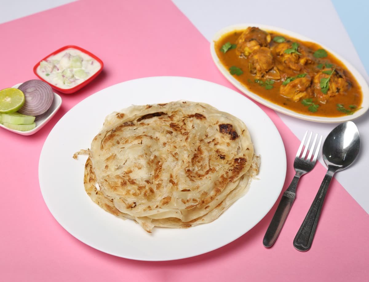 Layered parotta with chicken curry