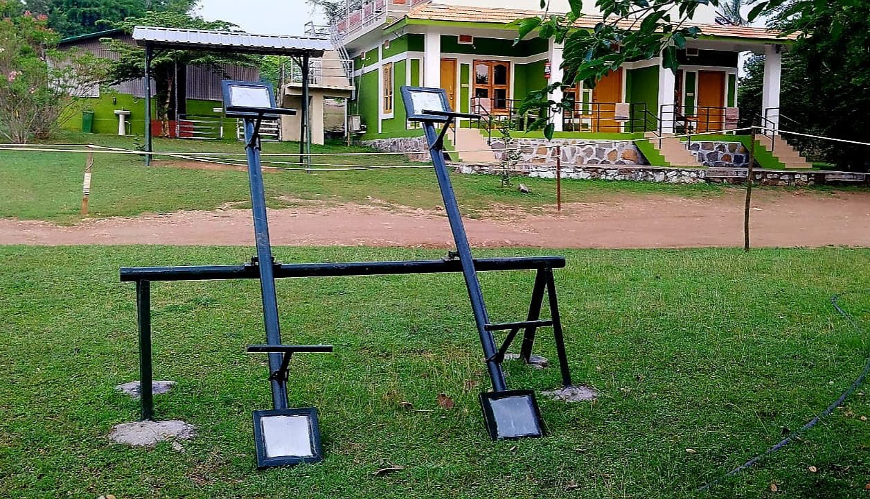Outdoor fitness equipment on the lawn in front of the homestay