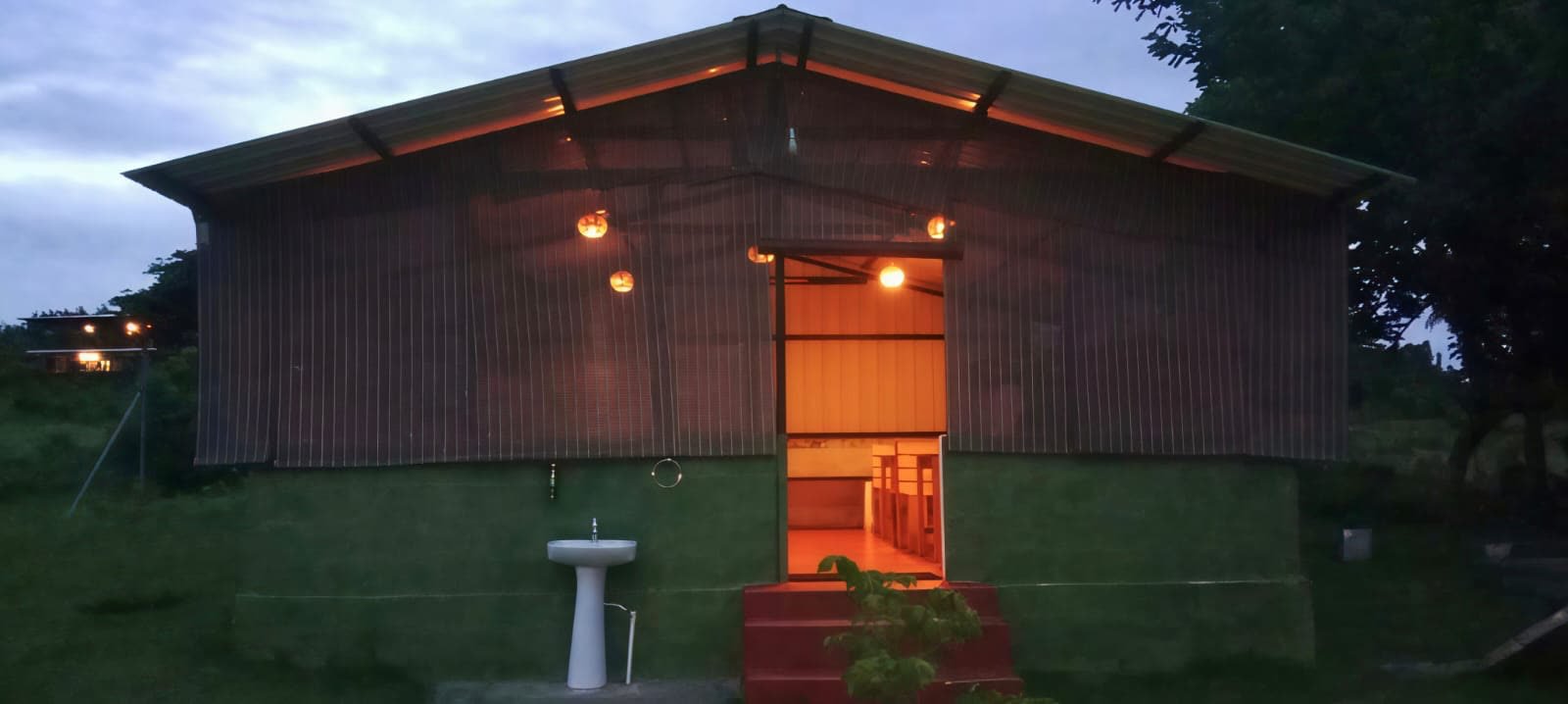 Clean attached washroom block with hot water at dusk